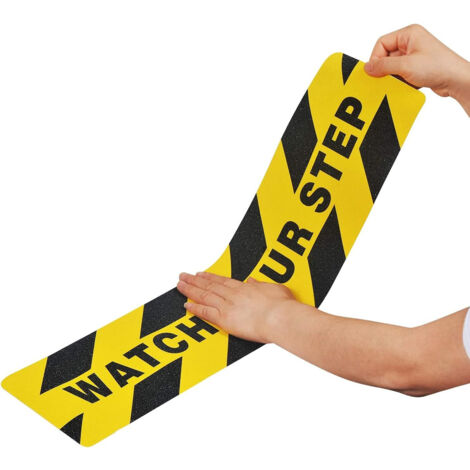 Adesivo antiscivolo giallo-nero con scritta "WATCH YOUR STEP"