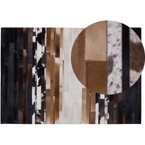 Alfombra de piel negra y beige 140 x 200 cm rectangular patchwork hecha a mano Dalyan