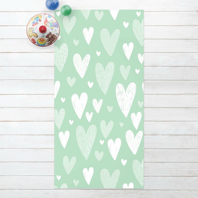 

Alfombras vinílicas - Small And Big Drawn White Hearts On Green - Alto 2:1 Dimensión LxA: 100cm x 50cm
