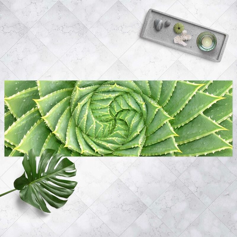 

Alfombras vinílicas - Spiral Aloe - Panorama Formato apaisado Dimensión LxA: 60cm x 180cm