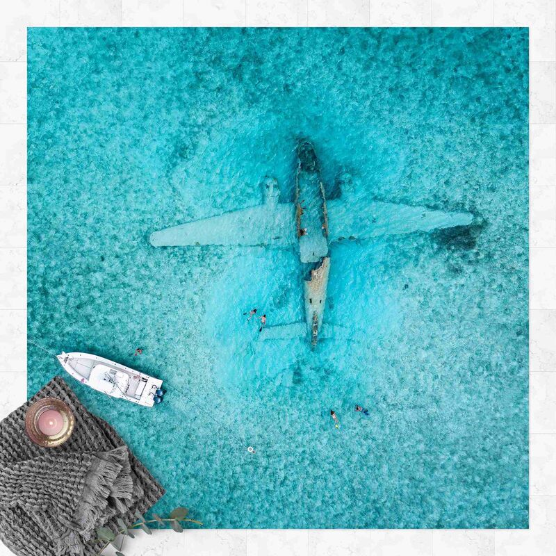 

Alfombras vinílicas - Top View Airplane Wreckage In The Ocean - Cuadrado 1:1 Dimensión LxA: 100cm x 100cm