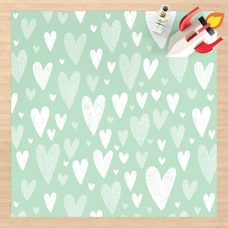 

Alfombras vinílicas - Small And Big Drawn White Hearts On Green - Cuadrado 1:1 Dimensión LxA: 80cm x 80cm