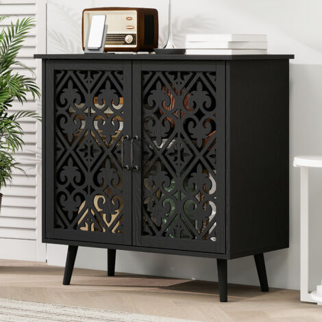 Armoire à deux portes avec des portes décoratives  Pieds en bois massif  Compartiments réglables dans les parois de l’armoire  Finition en verni noir, faite à la main  Armoire polyvalente et pratique