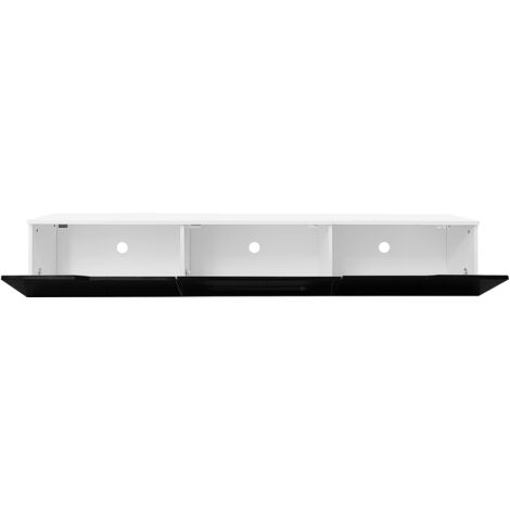 Armoire de télévision en noir et blanc, longue de 180 cm. Sa surface est de couleur mate. Elle est équipée d’un éclairage LED à 16 couleurs. L’armoire peut être installée au mur.