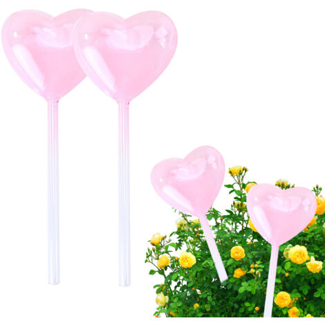 Aspersor automático rosa con forma de corazón, paquete de 2 unidades + vaso medidor, sistema de riego lento y económico para plantas de interior y jardín.