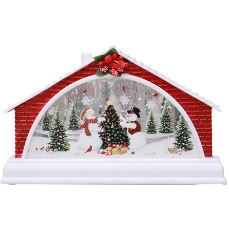 Beleuchtetes Weihnachtshaus mit Krippenszene und Schnee - Festliche Dorfdekoration für den Innenbereich