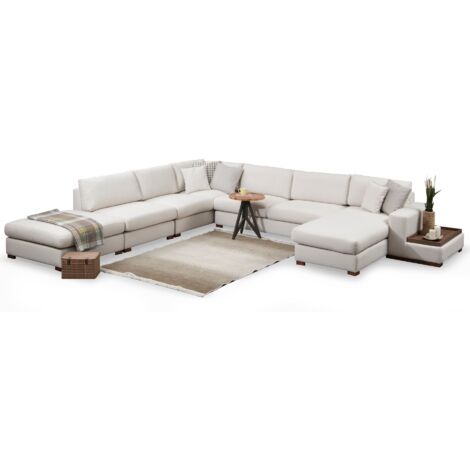 Canapé panoramique tissu beige clair avec étagère en bois et grande méridienne à gauche Zabora 374cm