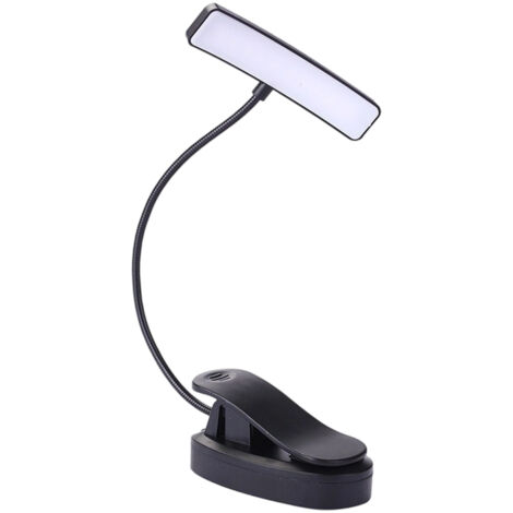 Cette lampe de table à pince, à large façade, pivote à 360°, ce qui la rend flexible et pratique pour une utilisation au lit.