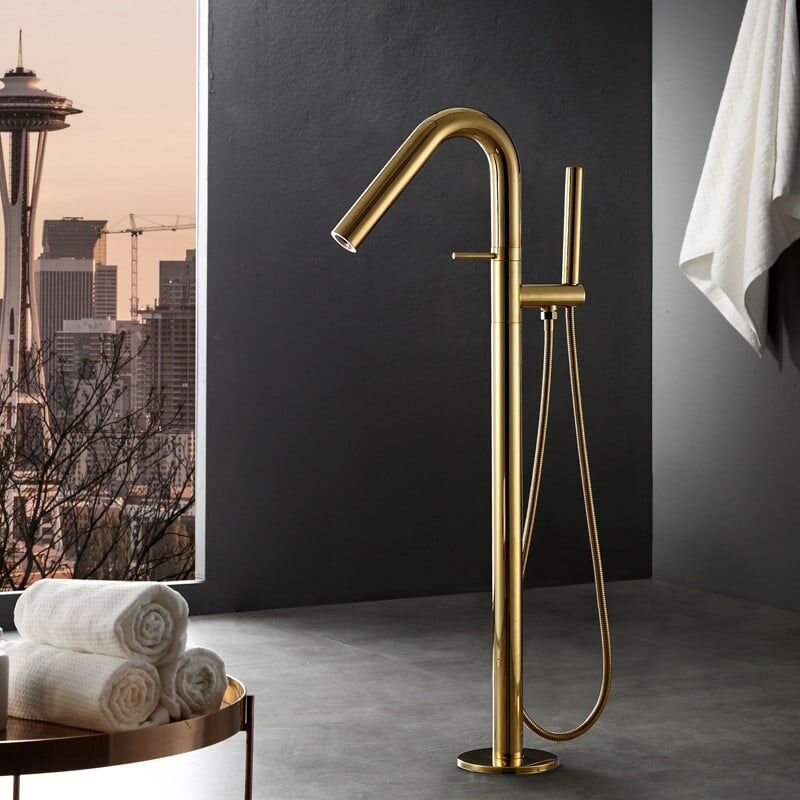 Contemporary freestanding bathtub faucet with floor mounting and gold handshower