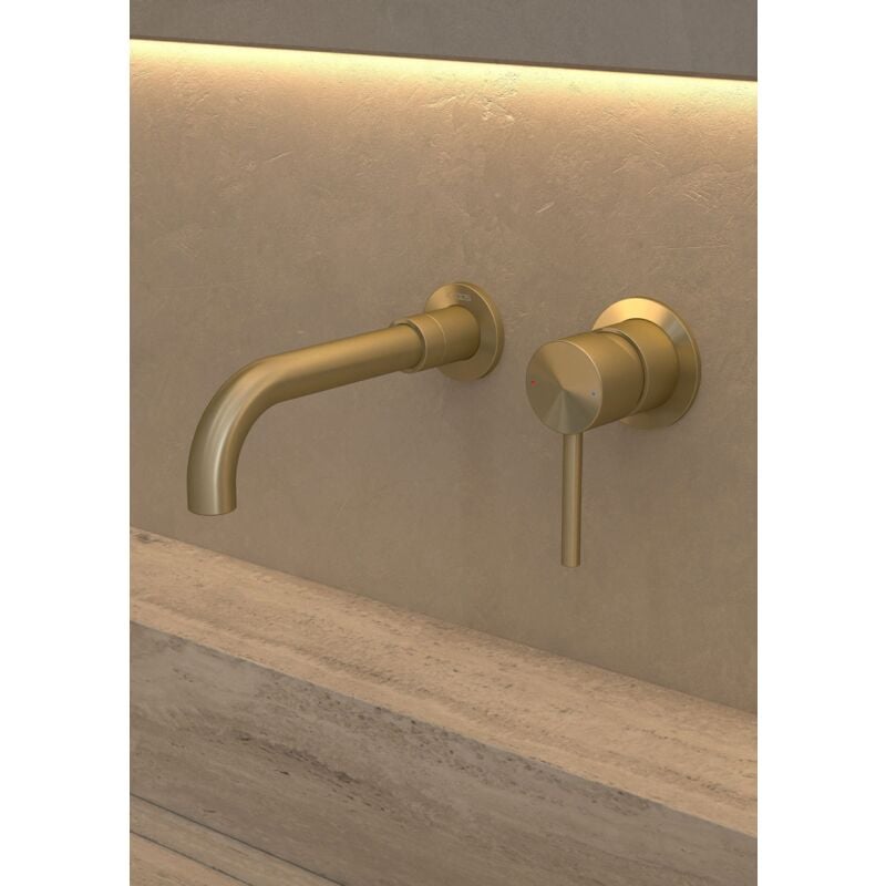 Contemporary wall-mounted single-handle bathroom sink faucet in brushed brass