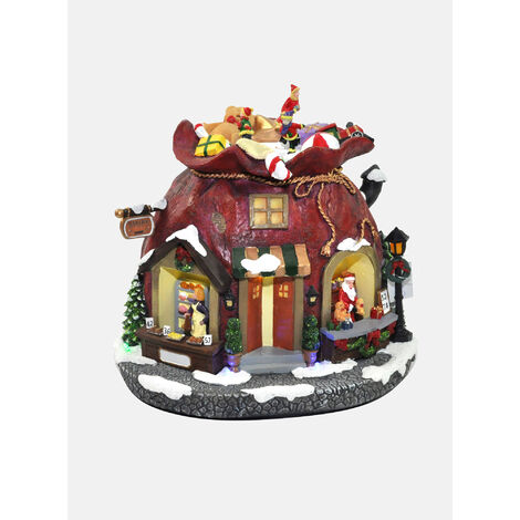 Dmora Statuetta natalizia con luci LED e musica, Villaggio Babbo Natale, Giostrina in movimento, Decorazione natalizia, cm 24,5x21x22,5, con imballo rinforzato