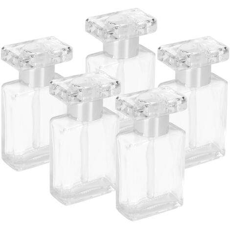 durchsichtige Glasfläschchen für ätherische Öle, wiederbefüllbar und tragbar, ideal für Reisen, mit silbernen Verschlüssen.