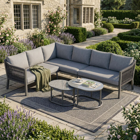 Ensemble jardin angle 6 personnes fer galvanisé plateau verre,composition modulable tables basses et canapé gris.