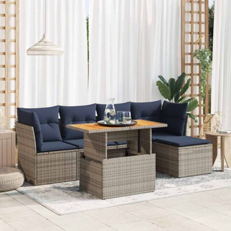 Ensemble salon de jardin 6 places en résine tressée grise avec coussins bleu marine, table modulable et rangements intégrés.