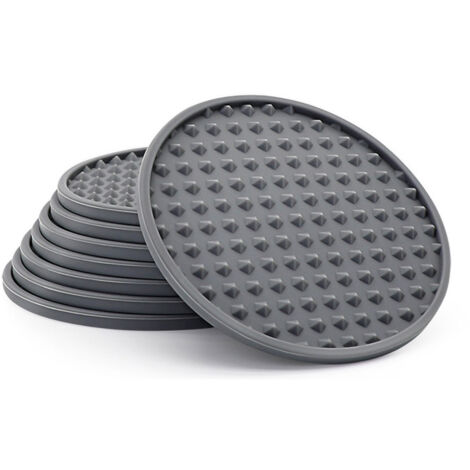 ensemble8Un dessous de verre en silicone gris pour protéger les surfaces en bois, en verre ou en marbre.