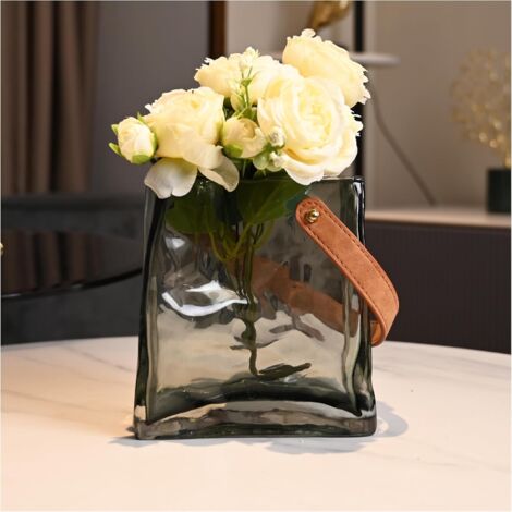 Este jarrón, fabricado en vidrio gris grueso y transparente y con forma de bolso, es una opción ideal para la decoración de interiores.