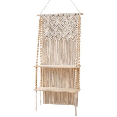 Étagère murale bohème en macramé à pompons, style bohème, avec support pour plantes en corde de coton tressée et étagères flottantes en bois.