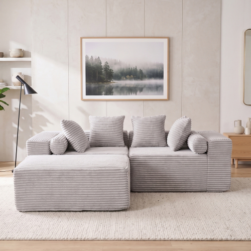 Canapé modulable gris livré compressé et sans montage avec outils