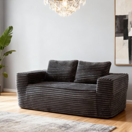 Canapé gris compressé et conditionné dans une boîte