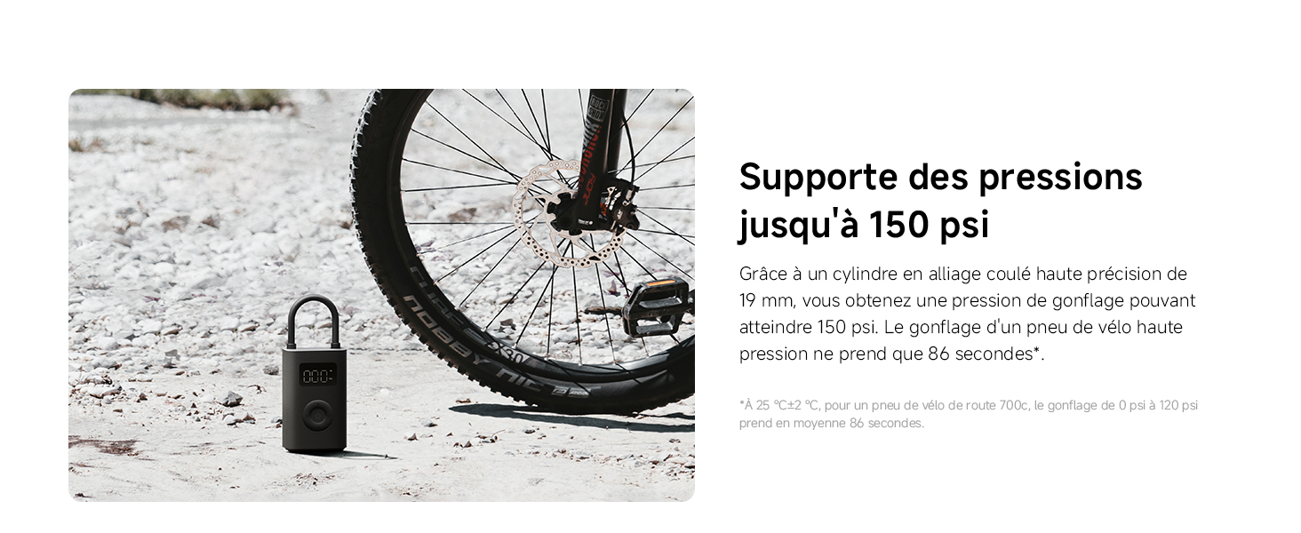 Le texte se lit comme suit : « Supportez des pressions jusqu'à 150 psi ». Pneu de vélo et antivol noir sur sol enneigé.