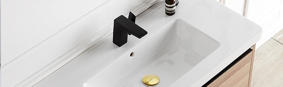 Bonde de lavabo doré.