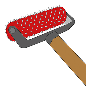 Un pinceau rouge à manche en bois