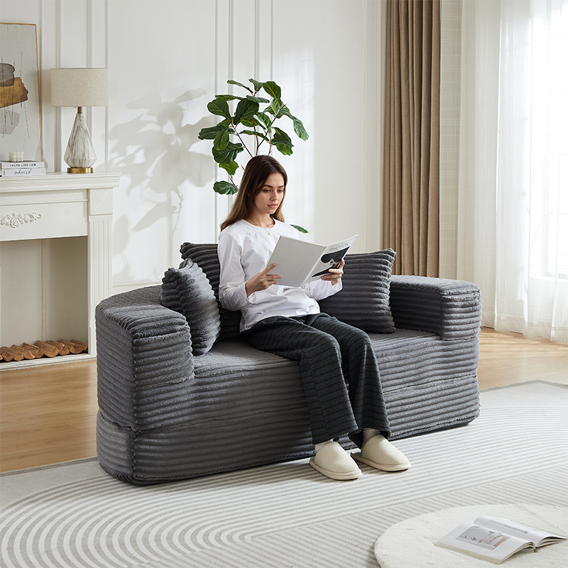Canapé demi-rond en tissu cord avec rangements dans les accoudoirs