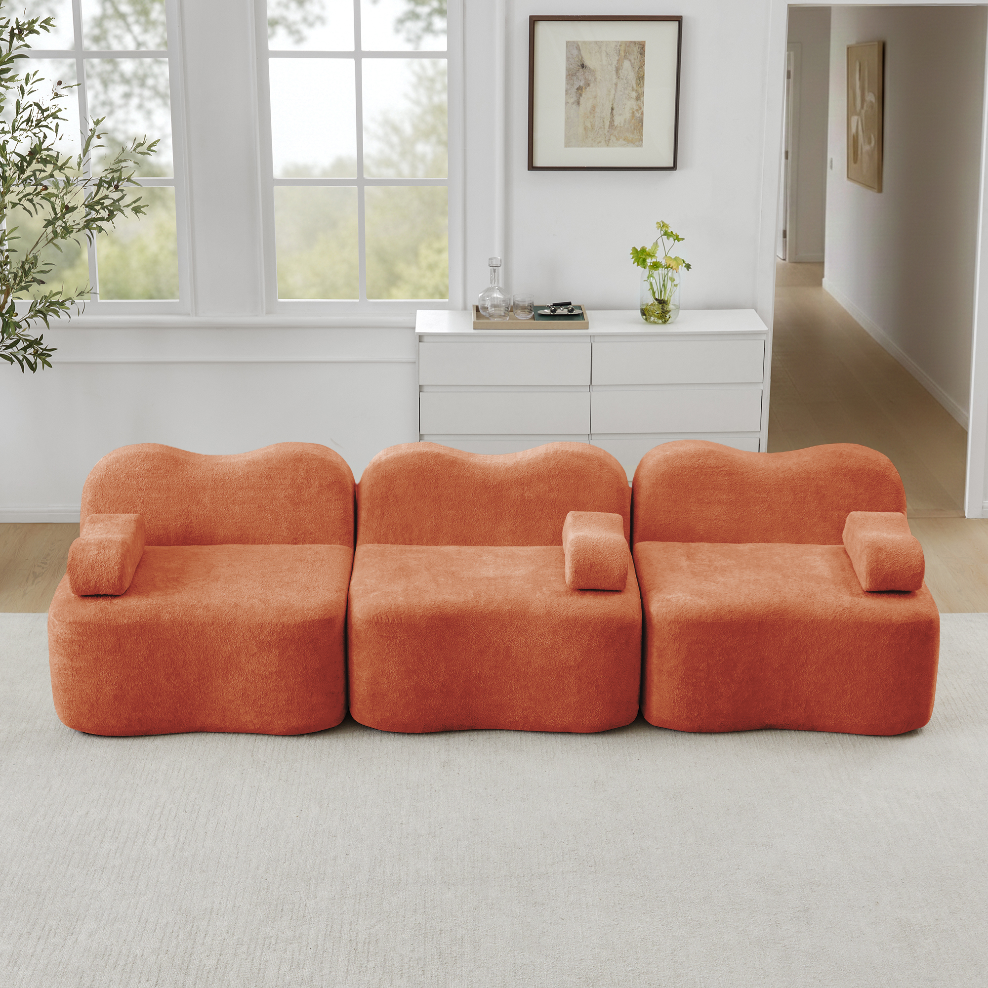Canapé modulaire 3 places orange en velours, sans structure rigide, avec assise profonde et forme ondulée