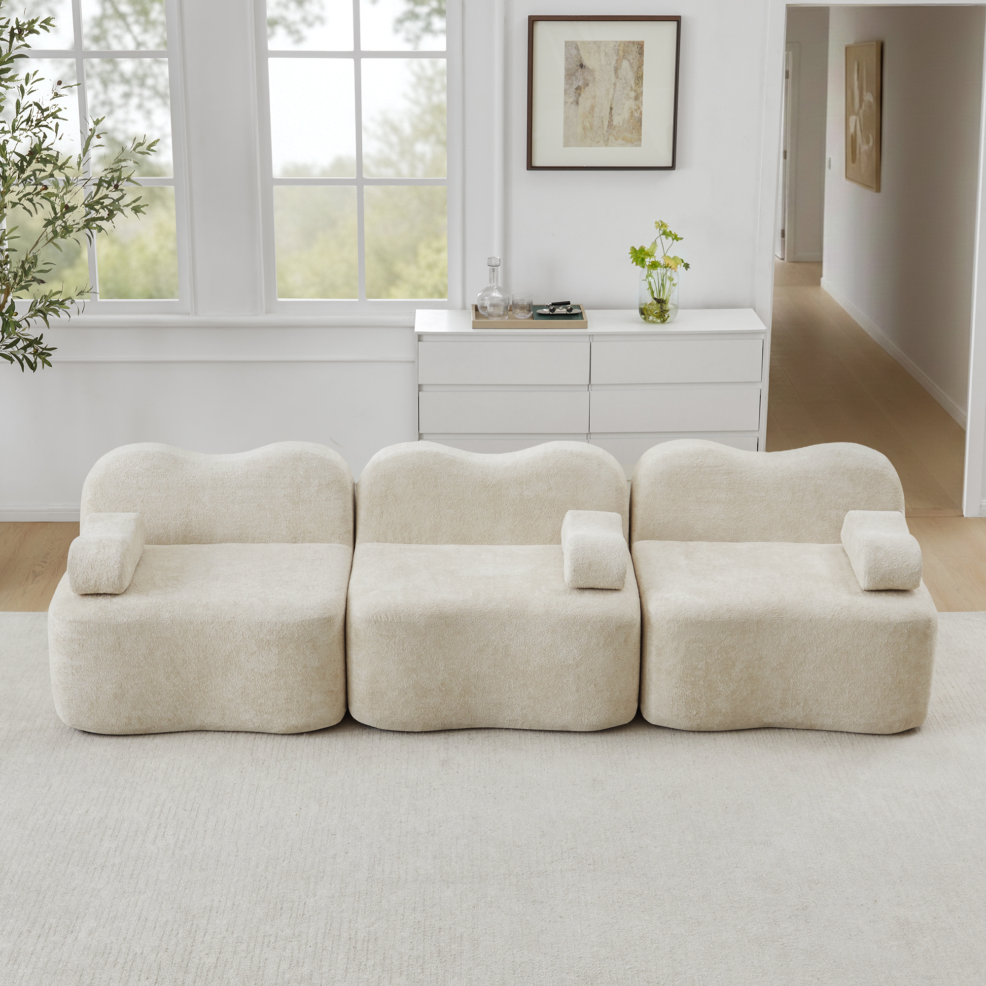 Canapé modulaire 3 places beige sans structure rigide avec assise profonde et forme ondulée