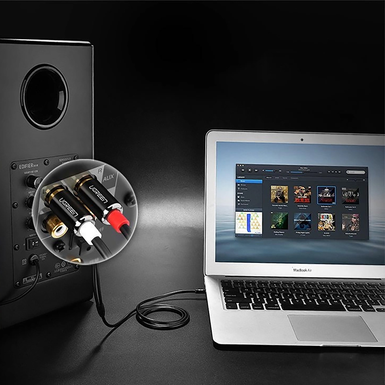 portátil conectado al sistema de audio mediante el cable Ugreen AV116