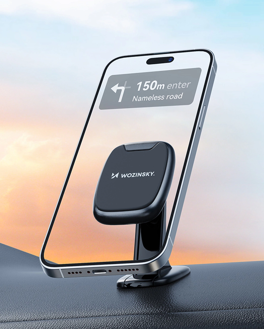 iPhone posizionato sul supporto magnetico Wozinsky WUMTD sul cruscotto dell'auto sullo sfondo del tramonto