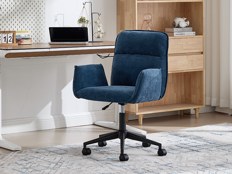 Office chair product showcase in navy blue upholstery. Multiple views showing the chair in a modern home office setting with wooden furniture.