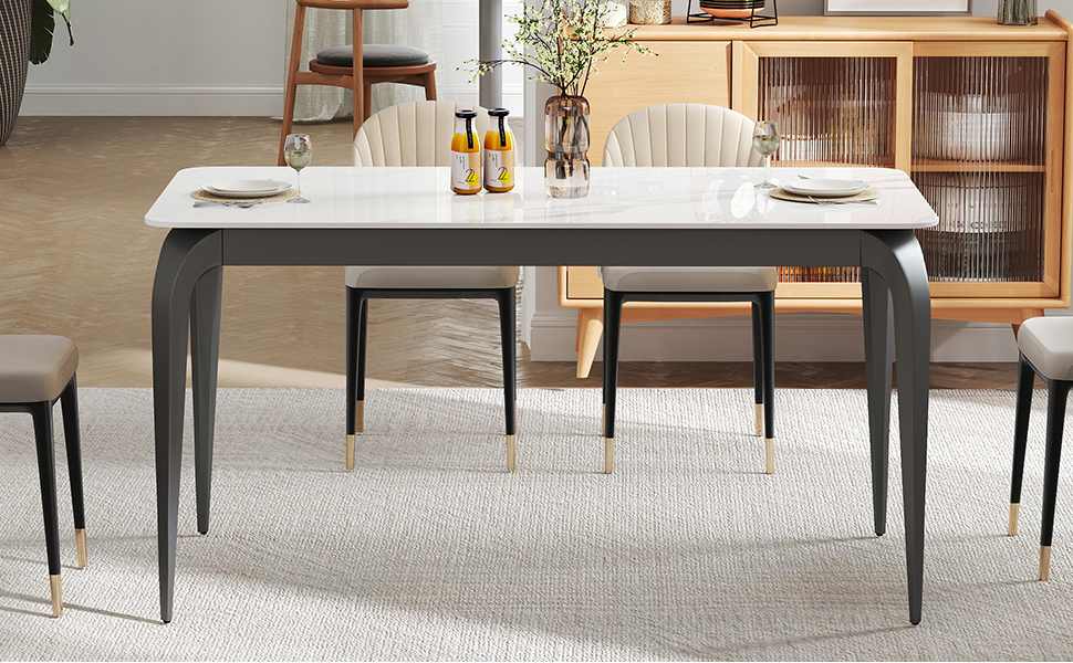 a white dining table with a white table and chairs.