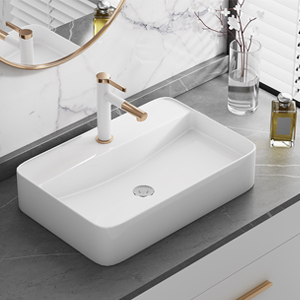 Modern rectangular white bathroom sink with sleek faucet mounted on gray countertop, showing contemporary minimalist design.