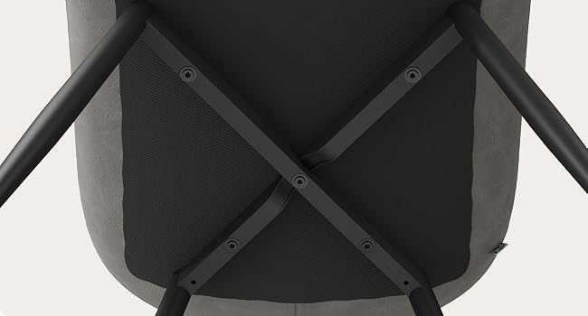 Modern black grill or cooking appliance shown from multiple angles, featuring a sleek design with curved edges and a domed lid. Device appears to have temperature controls and non-stick surface.