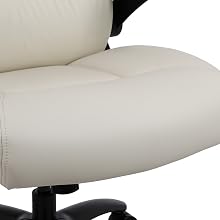 Close-up of an office chair seat cushion in cream-colored leather or faux leather. The cushion shows smooth, padded contours with visible seams and stitching.