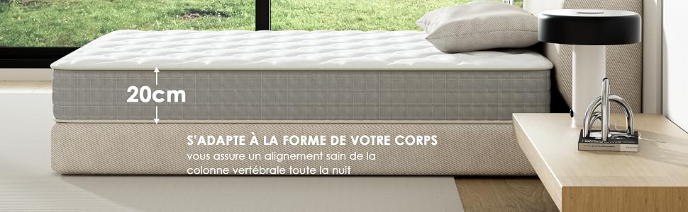 d'une épaisseur de 20 cm, démontrant son adaptabilité à la morphologie. Housse en tissu gris sur le dessus du matelas, base beige visible en dessous.