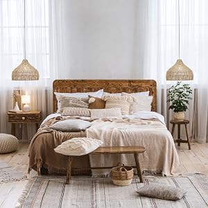 Boho lamp shades hanging over bedside tables