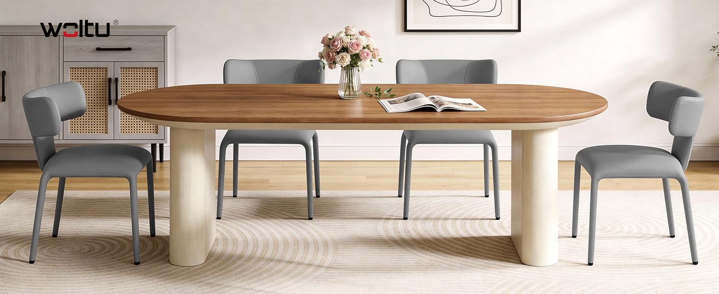 Modern dining room set featuring oval wooden table with light-colored base and grey upholstered chairs in contemporary style.