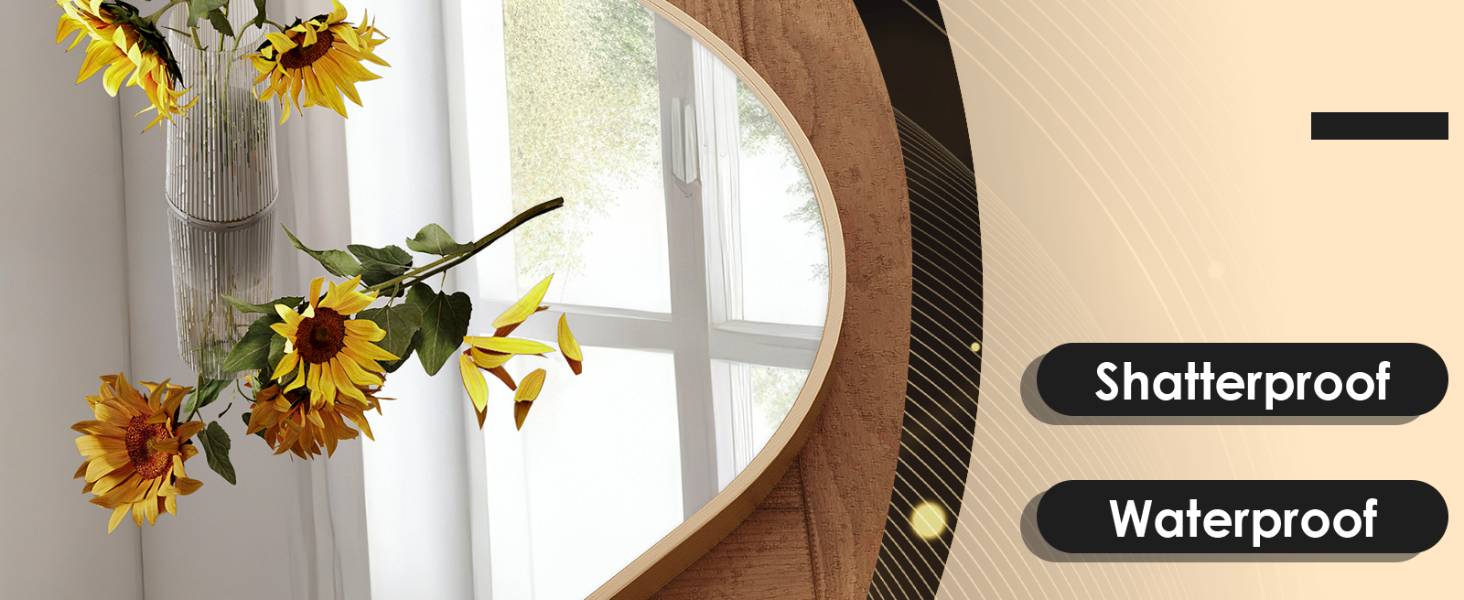 Close-up of a curved brown object with a reflective surface, possibly a mirror or screen. Text labels indicate it is shatterproof and waterproof. Sunflowers in a vase visible in background.