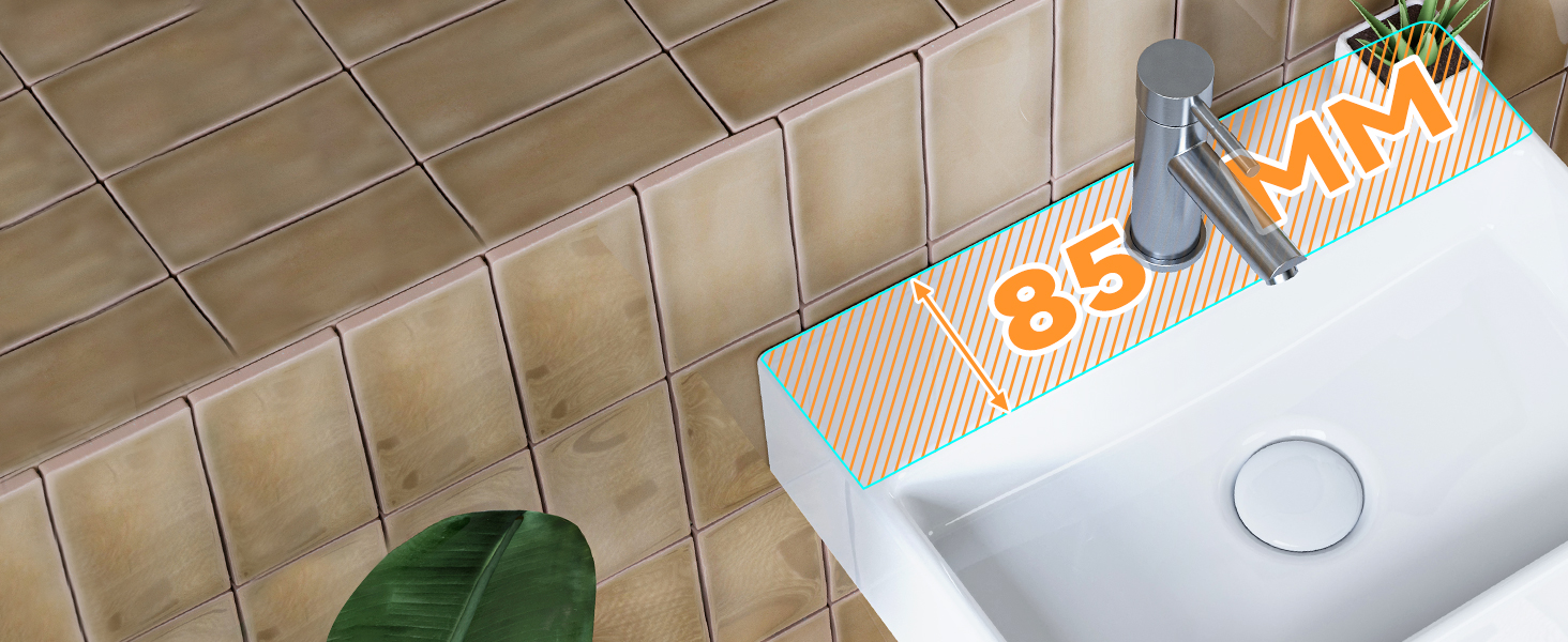 Modern white bathroom sink with orange and white striped label text displaying '83 MAX' on its surface.