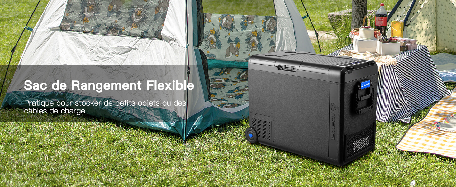 Unité de rangement portable ou glacière noire placée sur l'herbe à proximité de l'équipement de camping, avec le texte français « Sac de rangement flexible