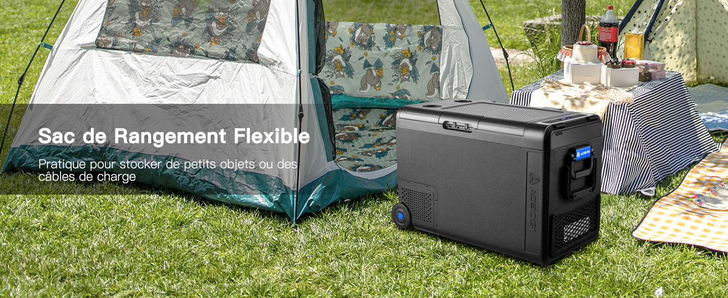 Grande boîte de rangement noire pour l'extérieur avec du matériel de camping. Le texte superposé indique « Sac de rangement flexible ». Les accessoires de tente et de camping sont visibles en arrière-plan.
