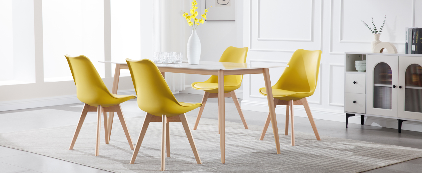Modern dining set featuring light wood table with six yellow upholstered chairs with wooden legs in bright white interior space.