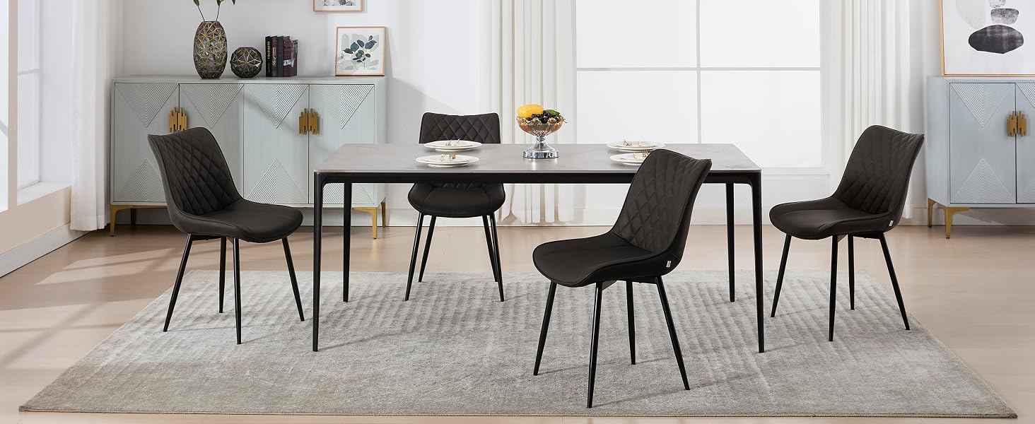 a dining table and two chairs in a room.