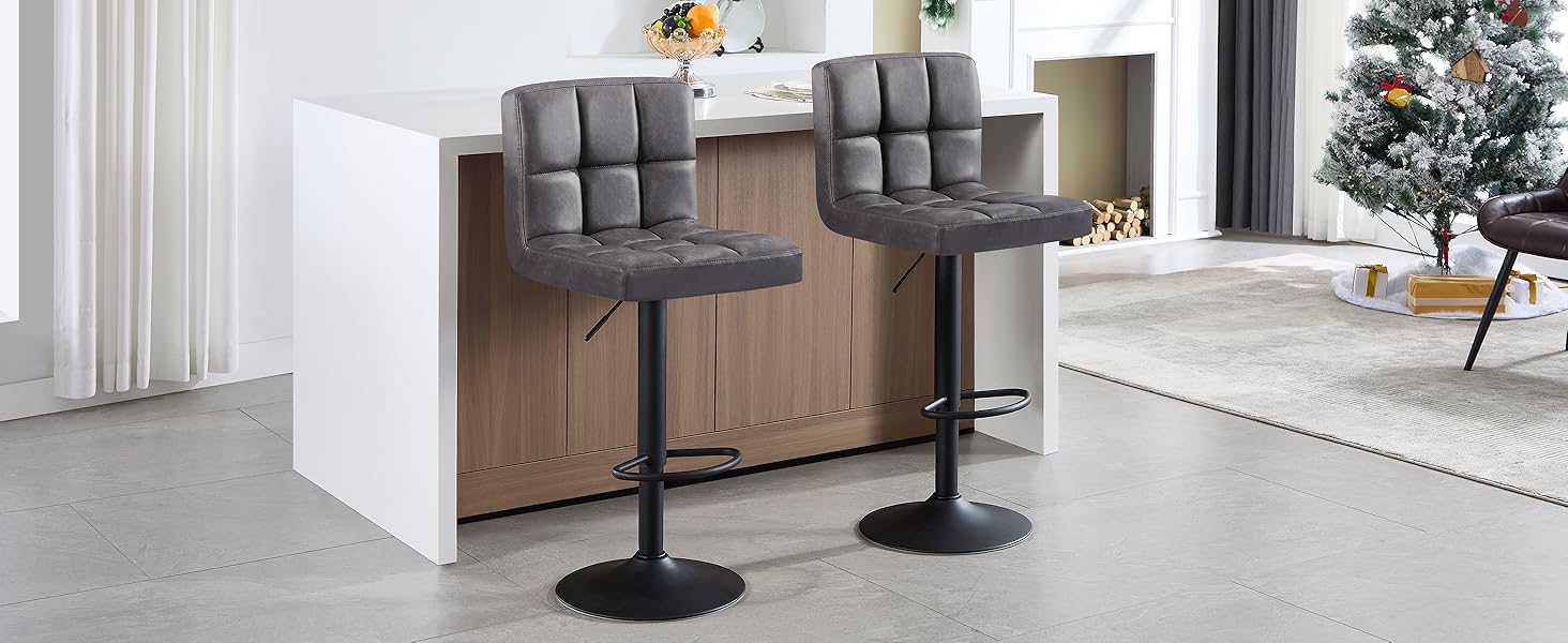 un taburete de bar gris con un cojín gris.