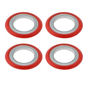Multiple red and silver circular adhesive rings or tape pieces arranged in pairs, appearing to be medical or therapeutic adhesives.