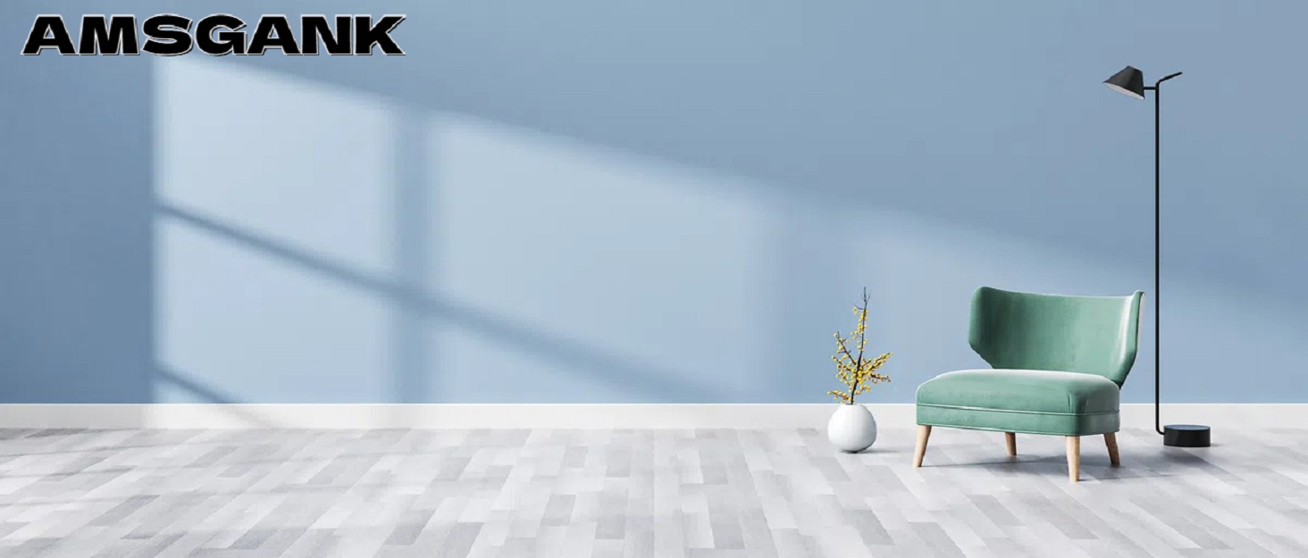 Modern living room interior with blue walls, white floors, a mint green armchair, and a floor lamp, showcasing a minimalist design aesthetic.