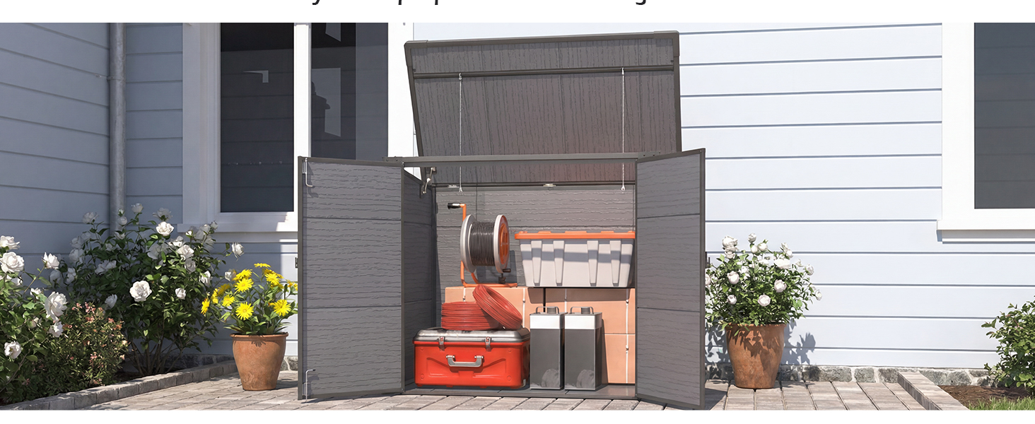 Exterior view of a house's side showing white siding, windows, and various items stored against the wall including pots and containers.