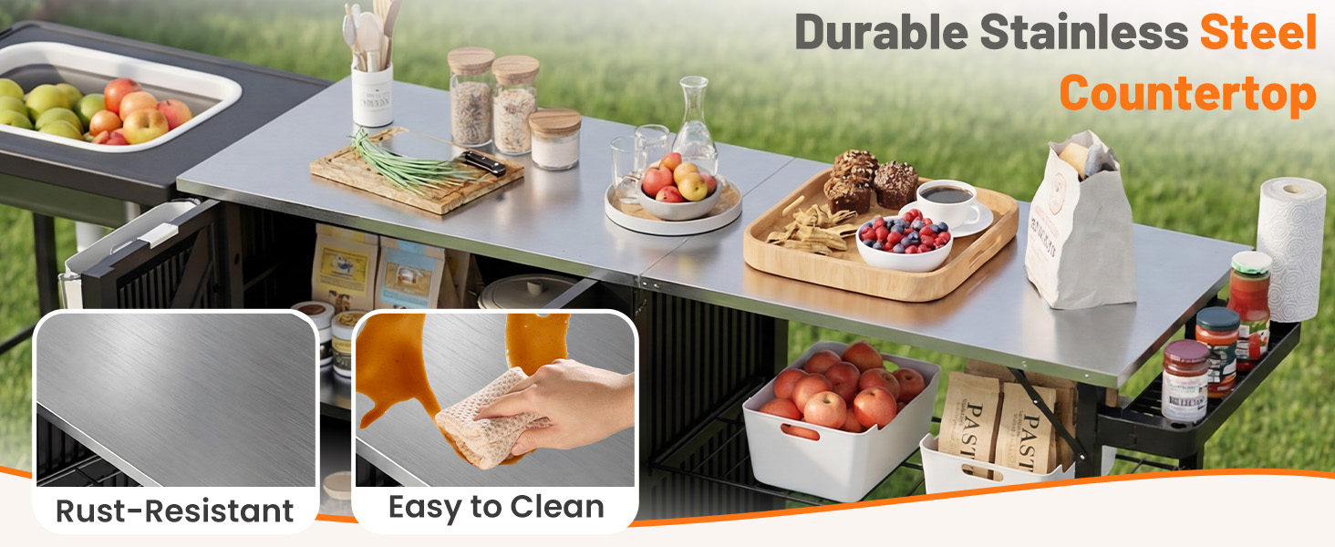 Text reads 'Durable Stainless Steel' with 'Steel' in orange, 'Countertop' in orange, 'Rust-Resistant', 'Easy to Clean'. Outdoor kitchen counter setup with stainless steel surface, food items, and serving accessories demonstrating durability and maintenance features.